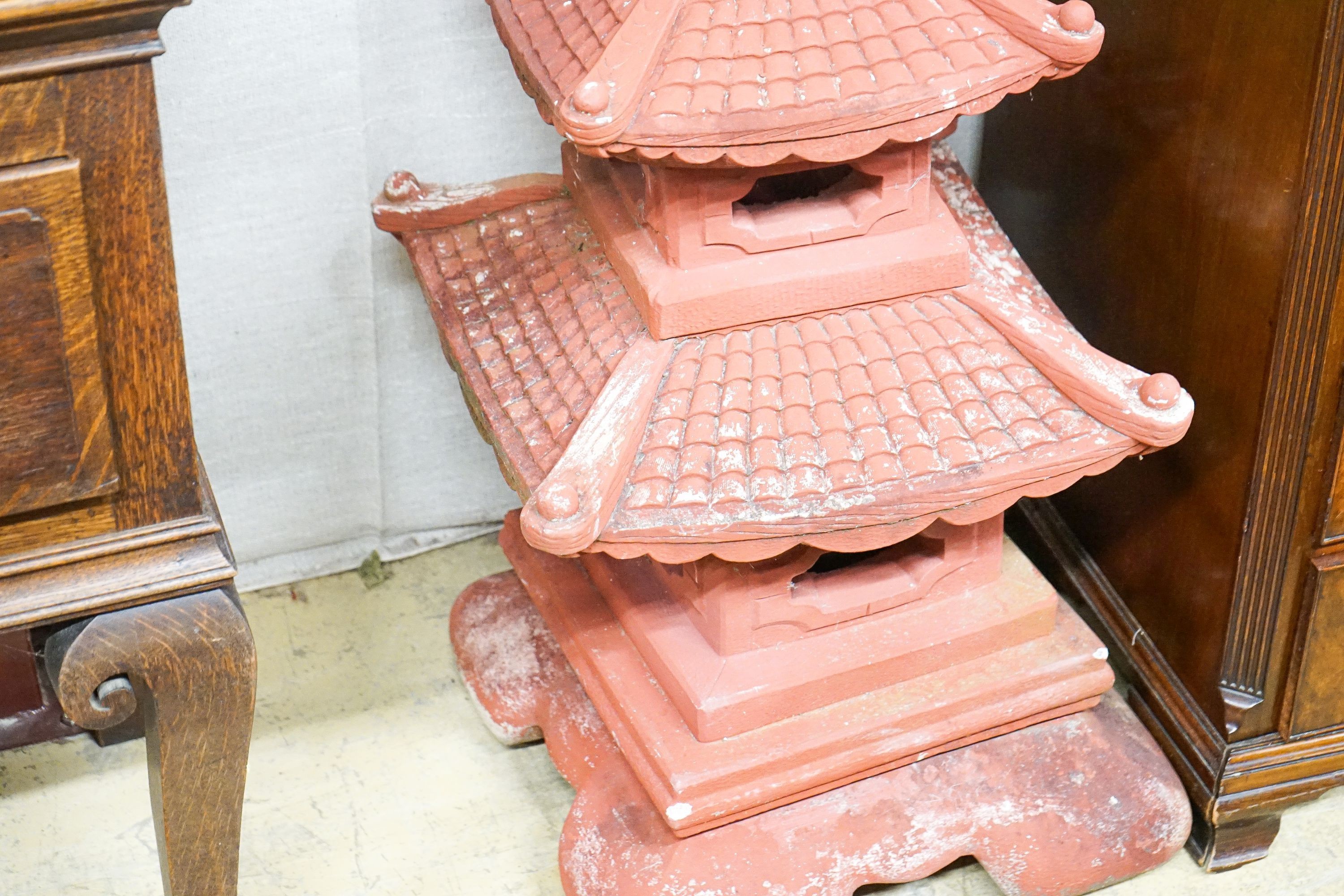 A painted reconstituted stone sectional pagoda garden ornament, height 104cm